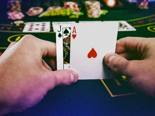 Blackjack hand of jack and ace on a Gaming Club table